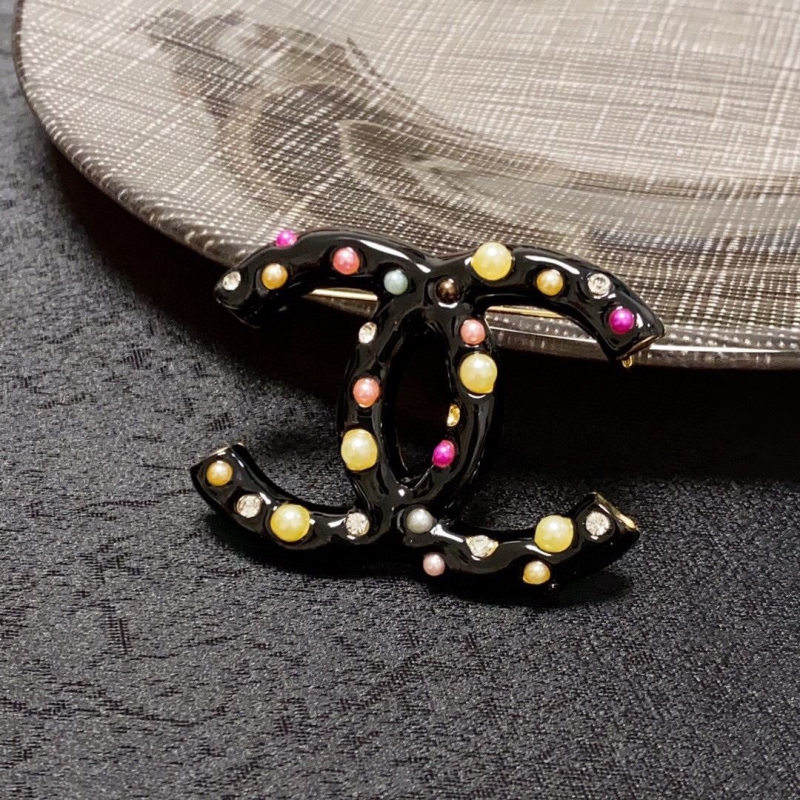 Ch**el brooches